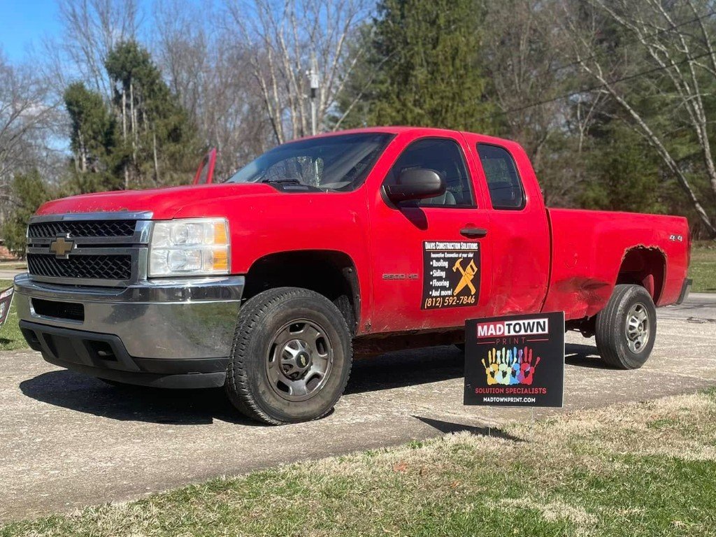Yard sign with work truck